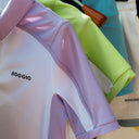 Colorful athletic shirts with 'ROGGIO' branding on a hanger.