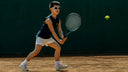 Junior Tennis player in action on a clay court wearing Roggio outfit